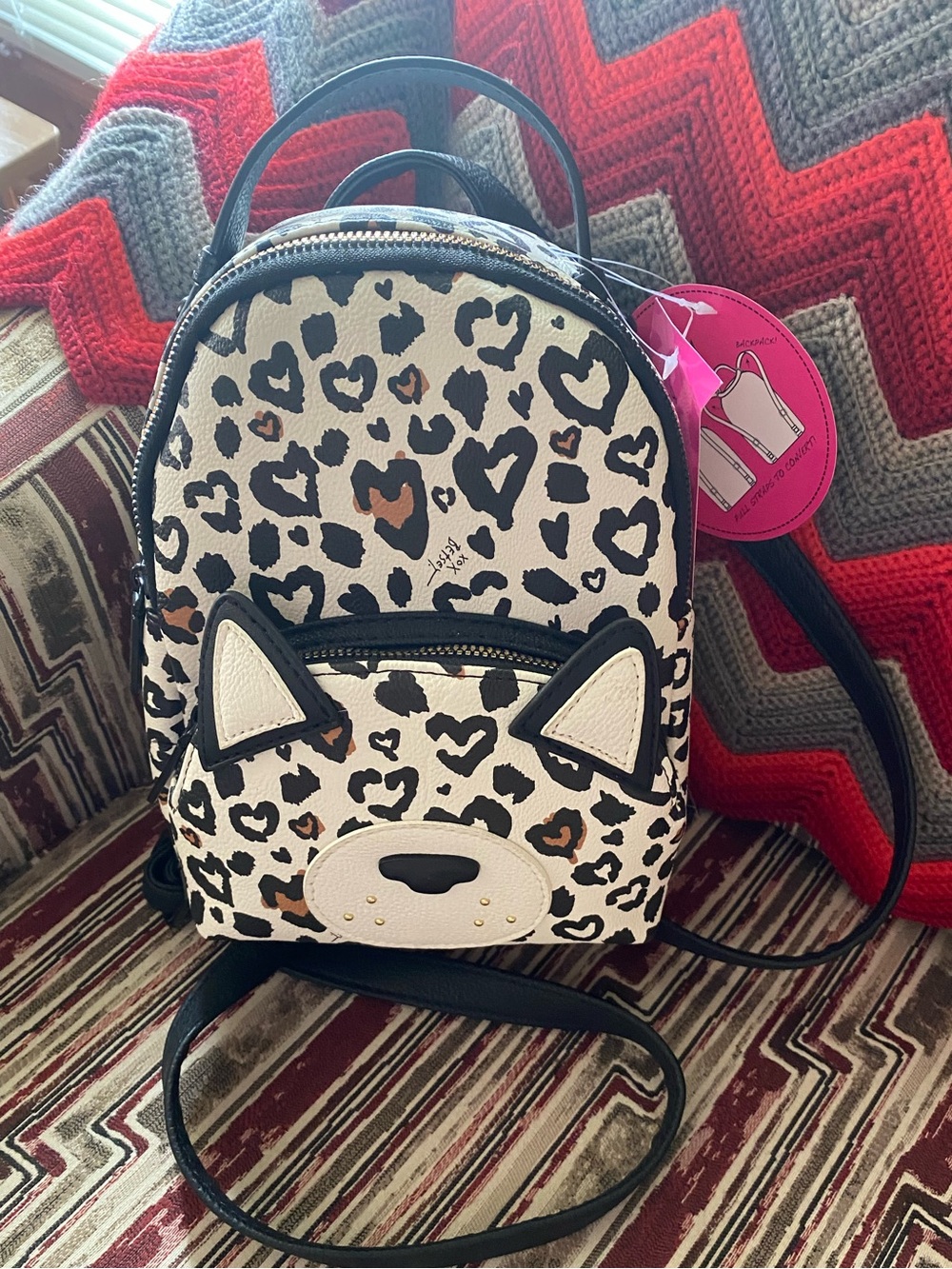 Betsey Johnson XO Baybee Mini
Backpack/Crossbody Cat
Face/Heart Leopard Print